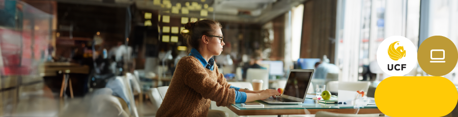 in an office space, writing in her computer trying to Invest in Your Future With CompTIA®