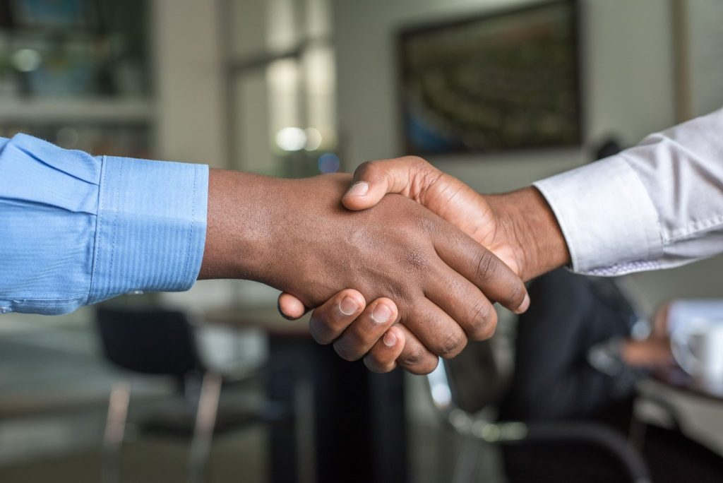 Image of two people shaking hands after an interview.